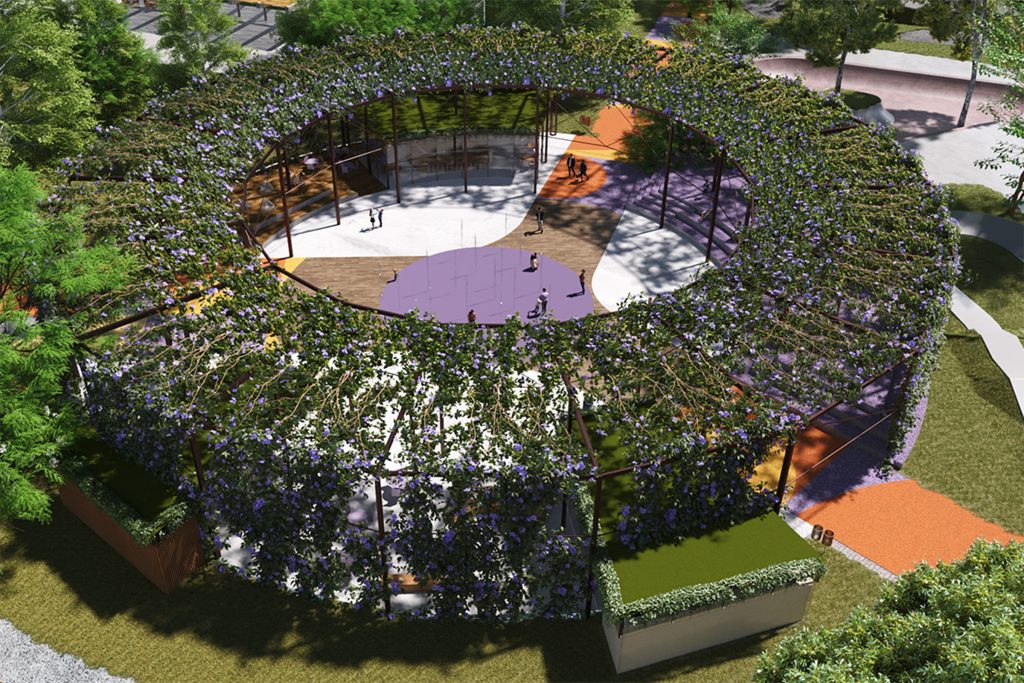 Vista aérea da arena cultural do Parque Santana, com estrutura circular coberta por vegetação e espaço multiuso no centro.