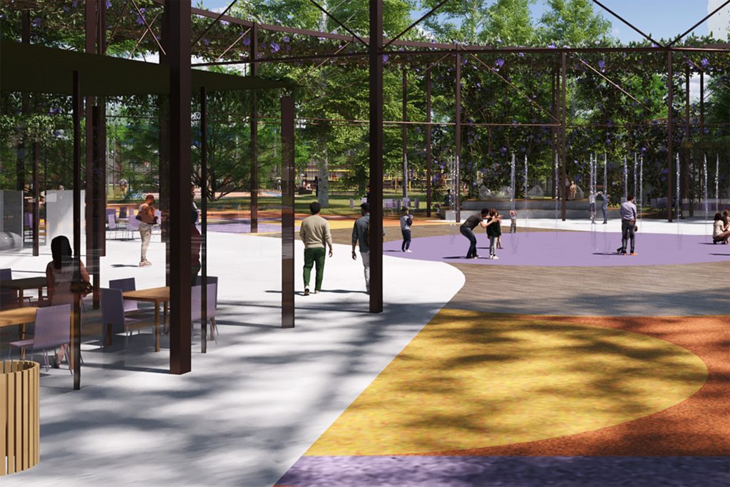 Arena cultural do Parque Santana com jatos d’água do play molhado, espaço de convivência e área de alimentação ao fundo.