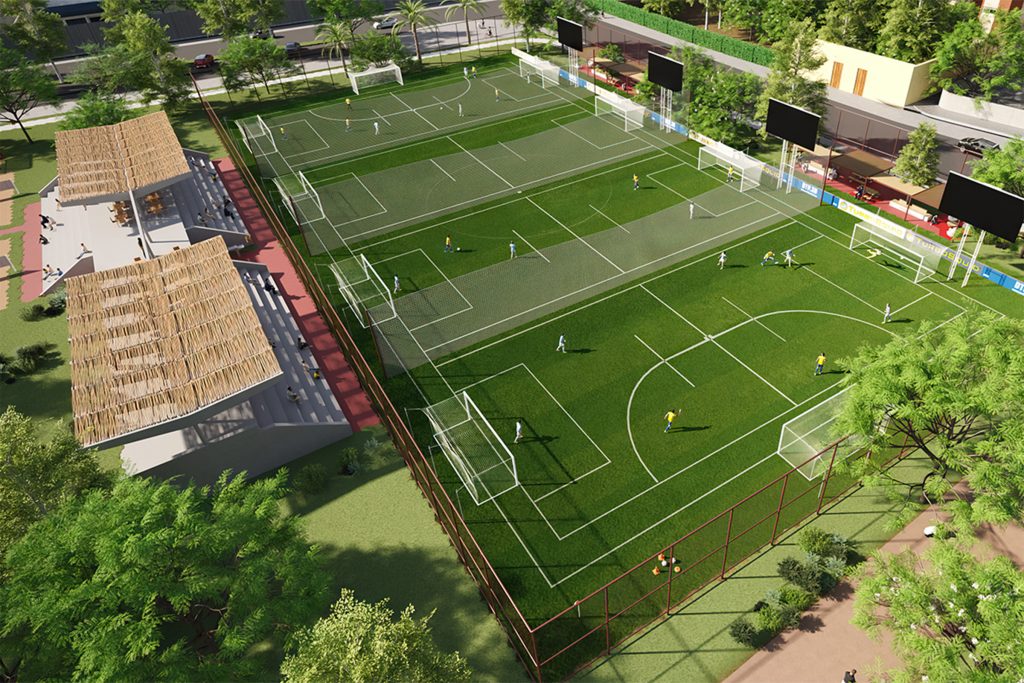 Campo de futebol do Parque Santana com arquibancadas cobertas, gramado sintético e estrutura para divisão em quatro campos menores.